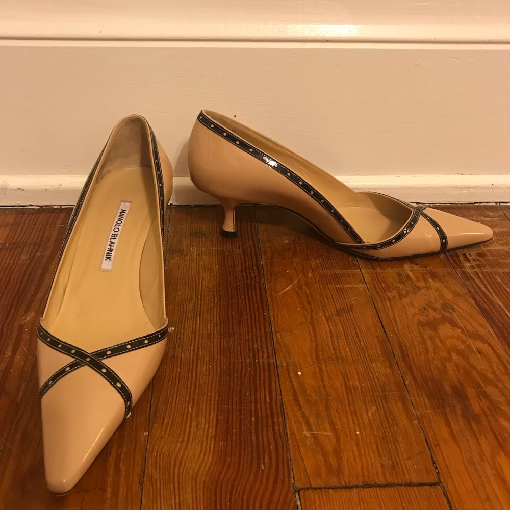 Manolo Blahnik nude patent leather pumps.
